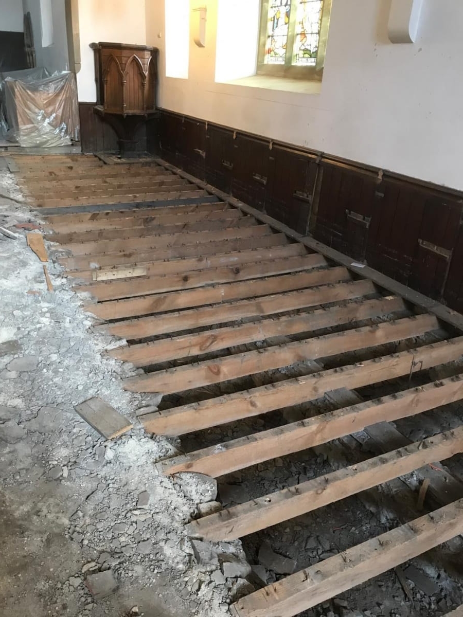 Pews removed exposing floor joists