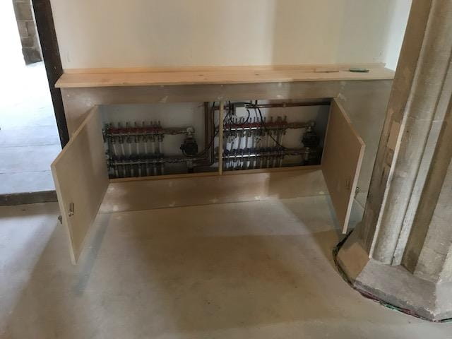 Cupboard hiding under floor heating